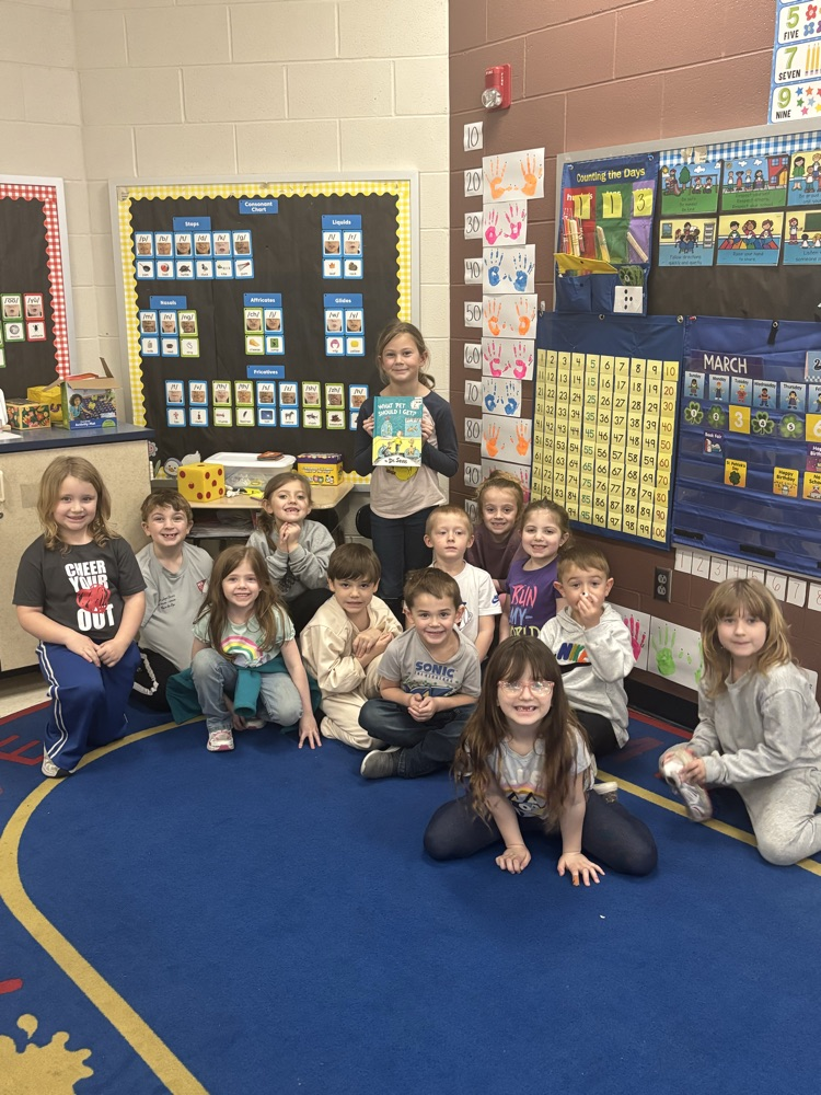 3rd graders reading to the kindergarteners 