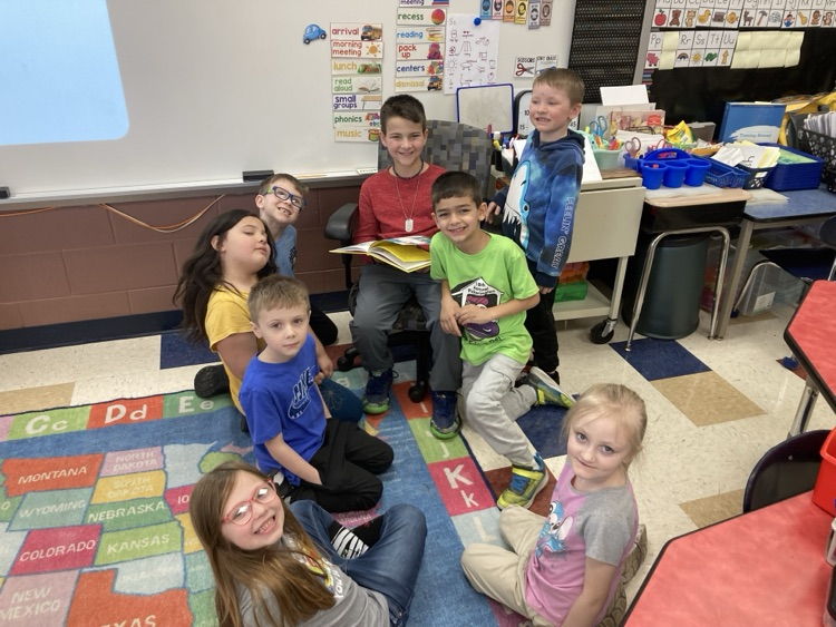 3rd graders reading to the kindergarteners 