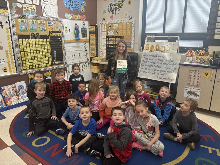 3rd graders reading to the kindergarteners 