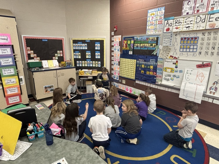 3rd graders reading to the kindergarteners 