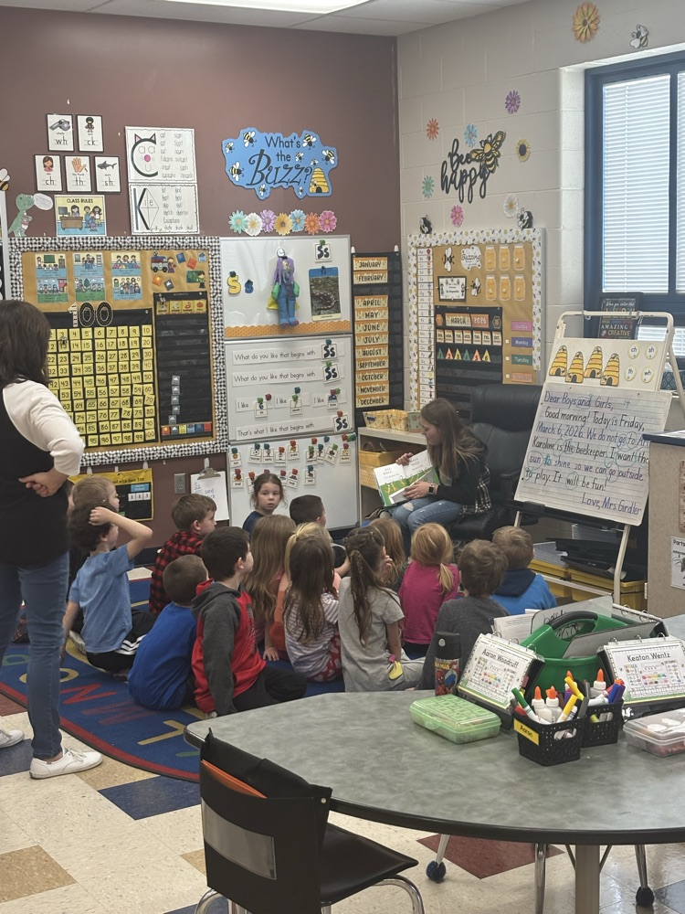 3rd graders reading to the kindergarteners 