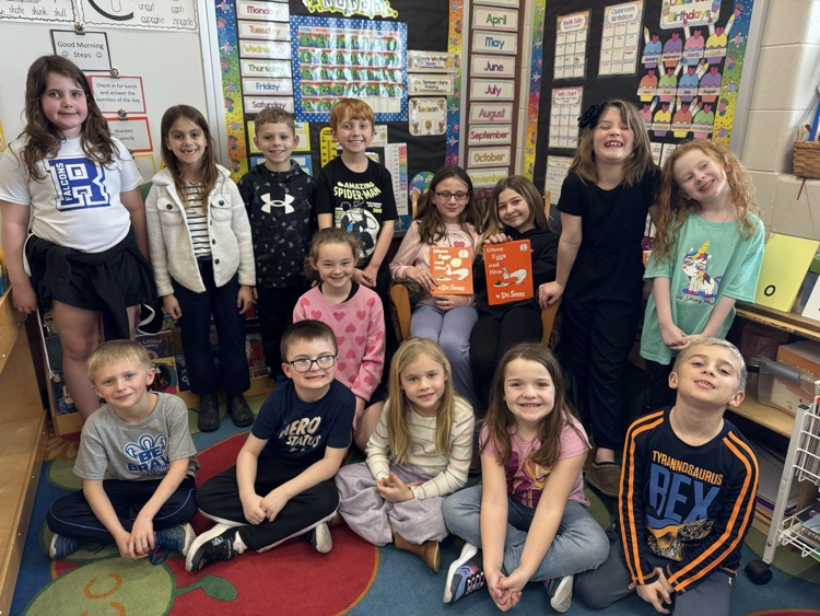 5th graders reading to 1st graders!