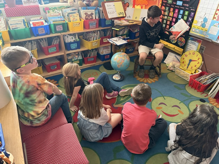 5th graders reading to 1st graders! 