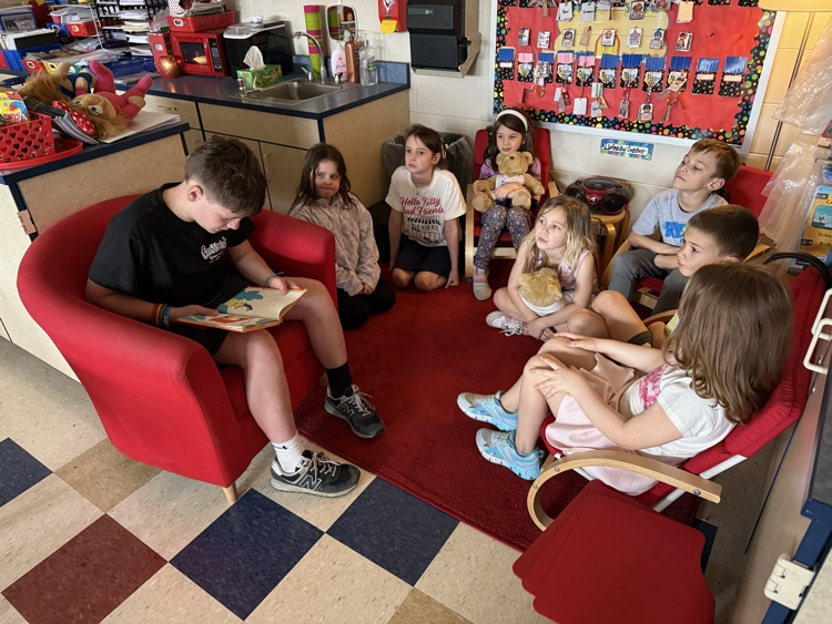 5th graders reading to 1st graders! 