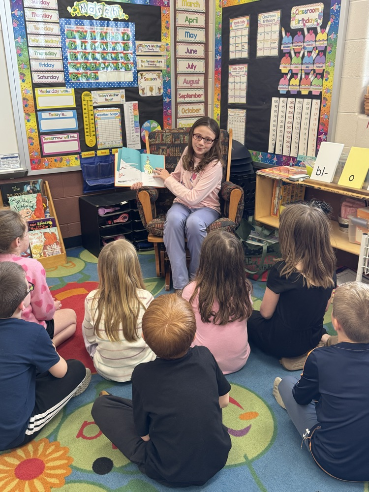 5th graders reading to 1st graders! 