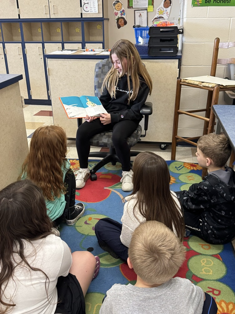 5th graders reading to 1st graders! 