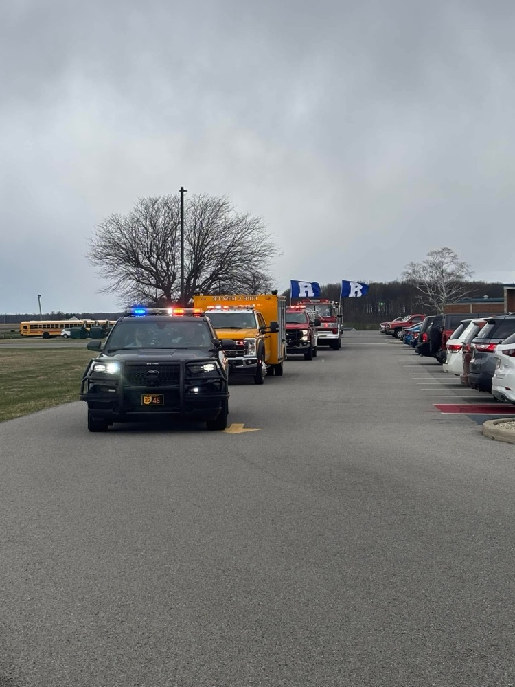 beginning of send off with firetruck and police officer