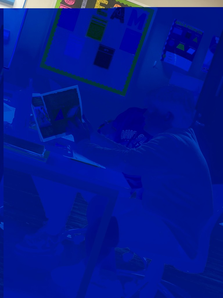 Student reading math adventure book