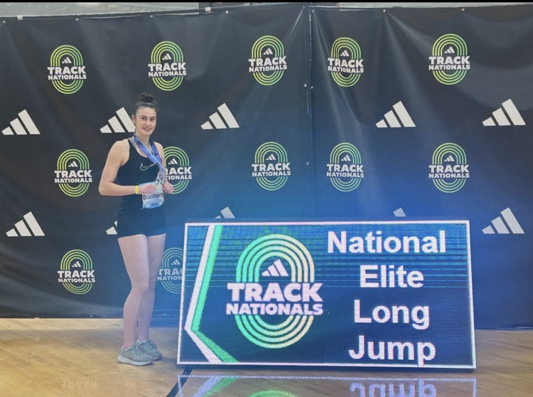 marissa at the national conference next to long jump 