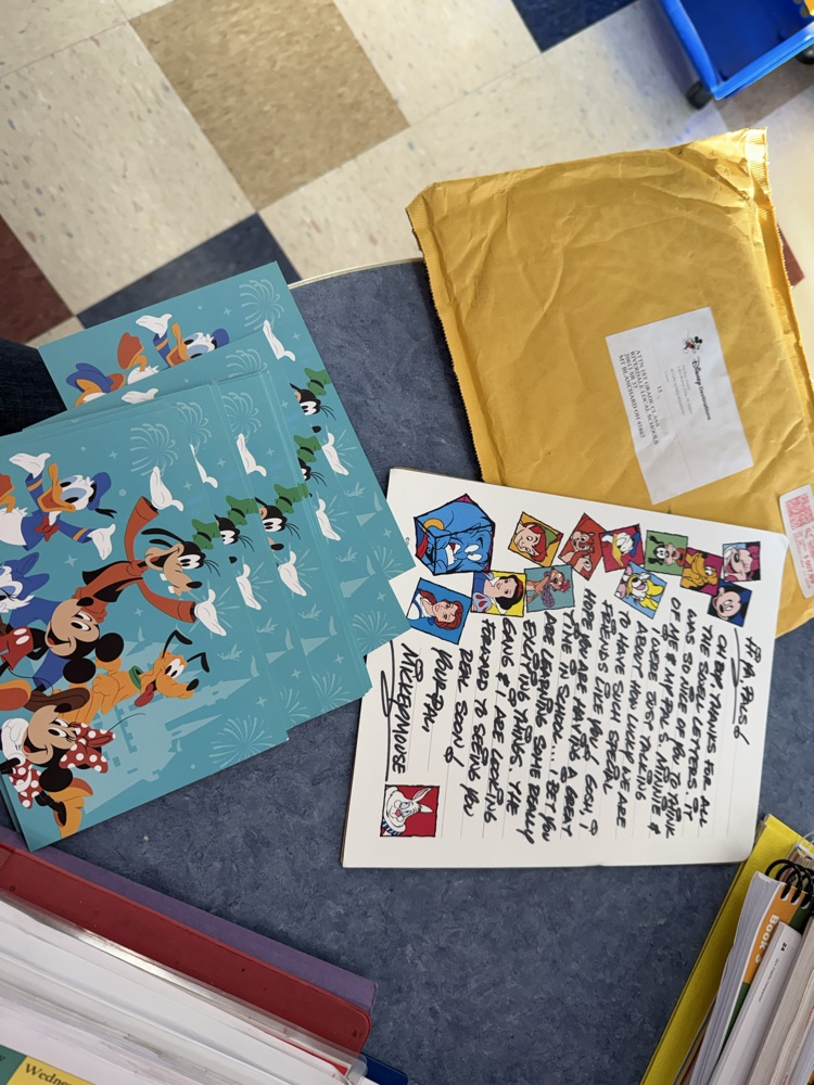 photo of letter from Mickey Mouse and postcards