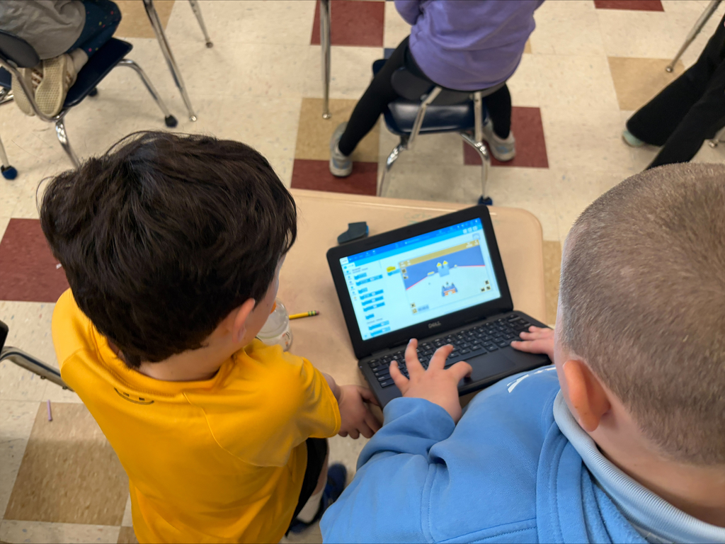 boys working together on computers
