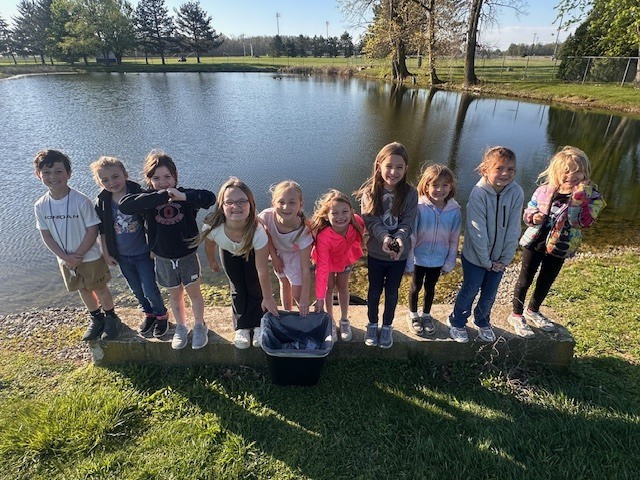 standing in front the the pond