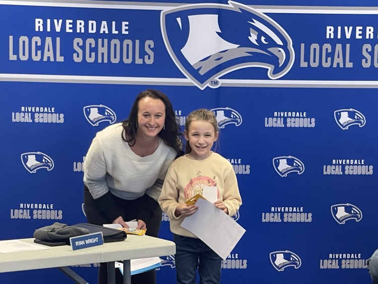 Mrs. Arnett giving a student of the month award. Happy National Principals day. 