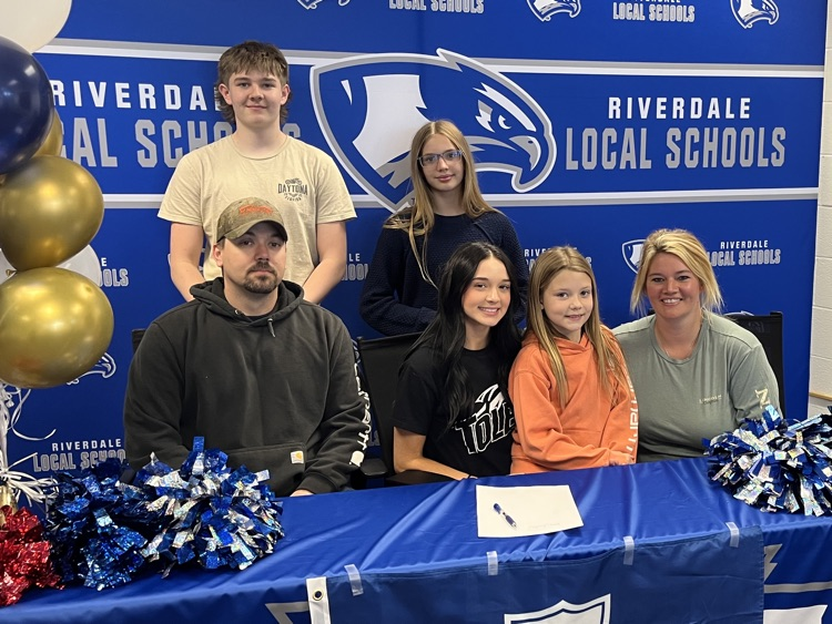 Kasey signing with family