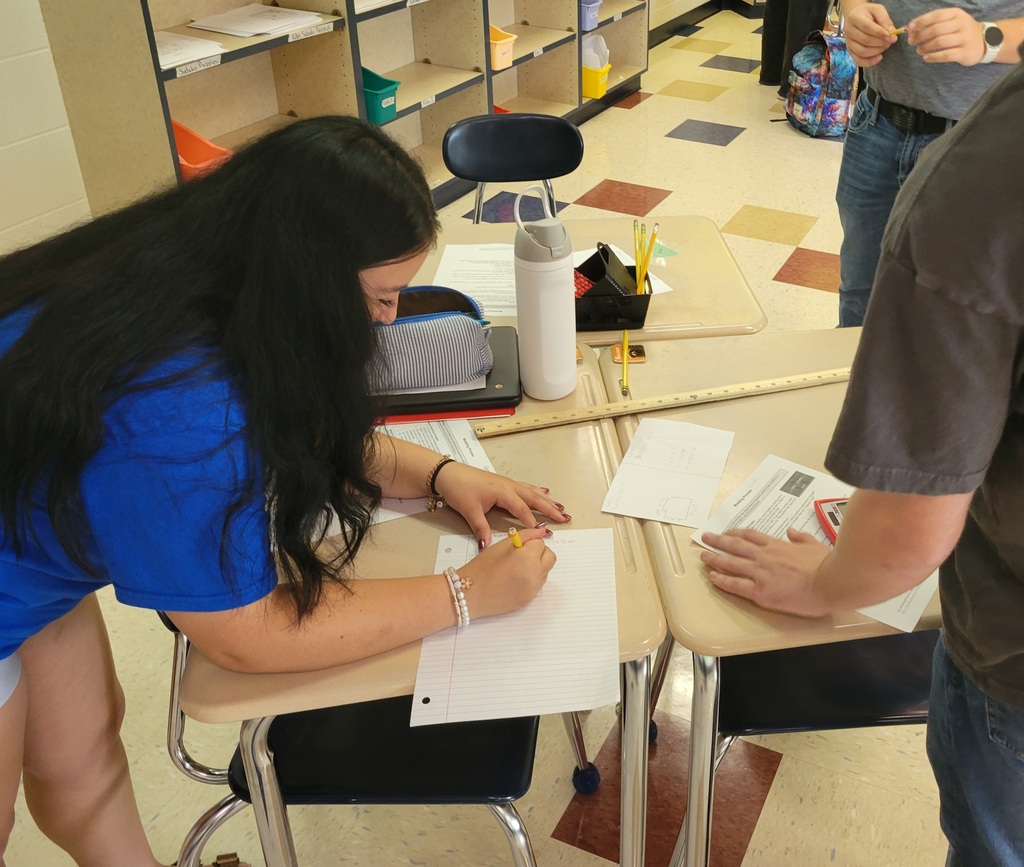 Students writing down their math