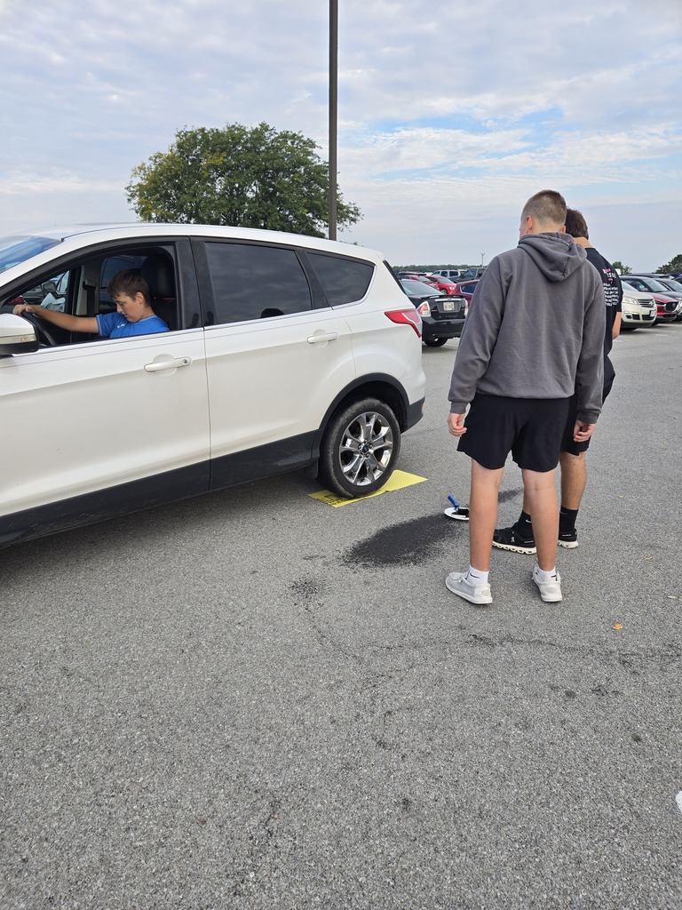 students learning how to make tire prints from their own cars