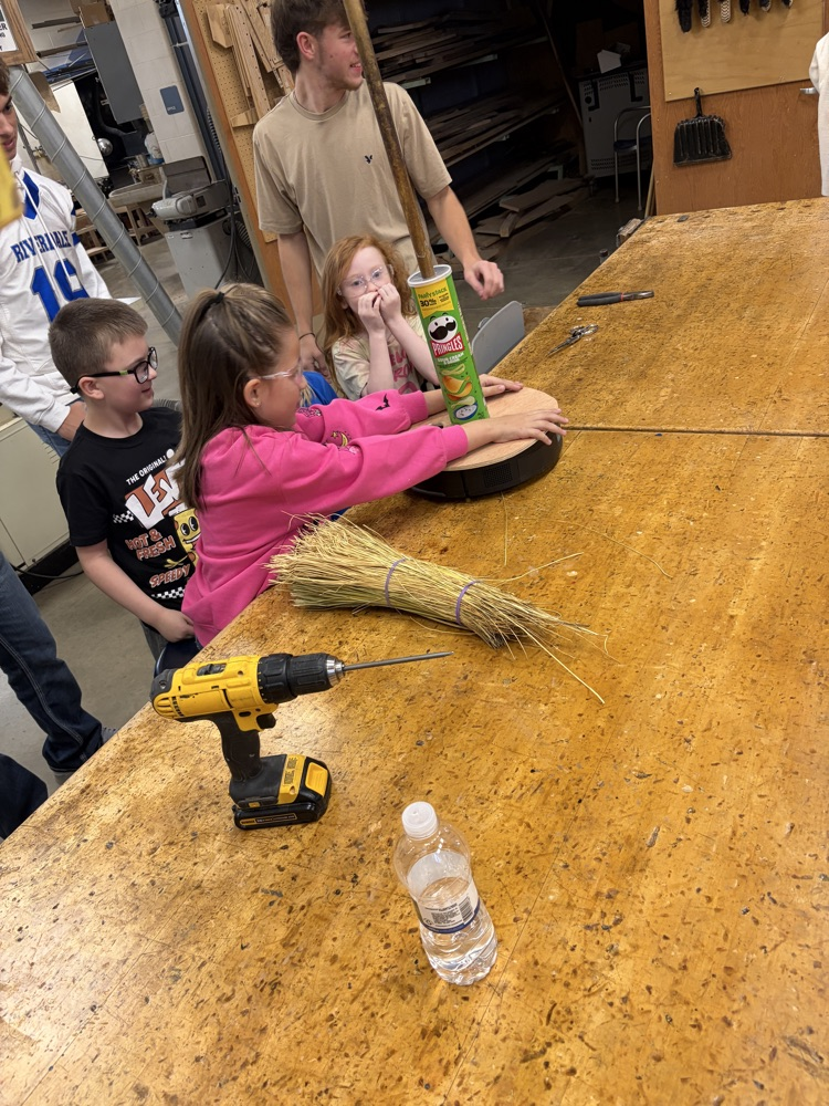 Elementary students helping HS robotics students build ROOMBA Halloween robots into ghosts/brooms/spiders