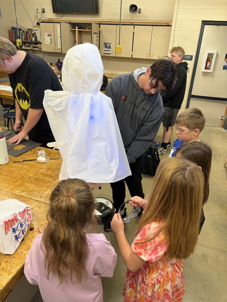 Elementary students helping HS robotics students build ROOMBA Halloween robots into ghosts/brooms/spiders