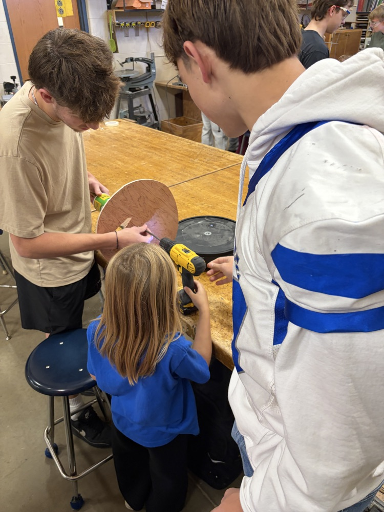 Elementary students helping HS robotics students build ROOMBA Halloween robots into ghosts/brooms/spiders