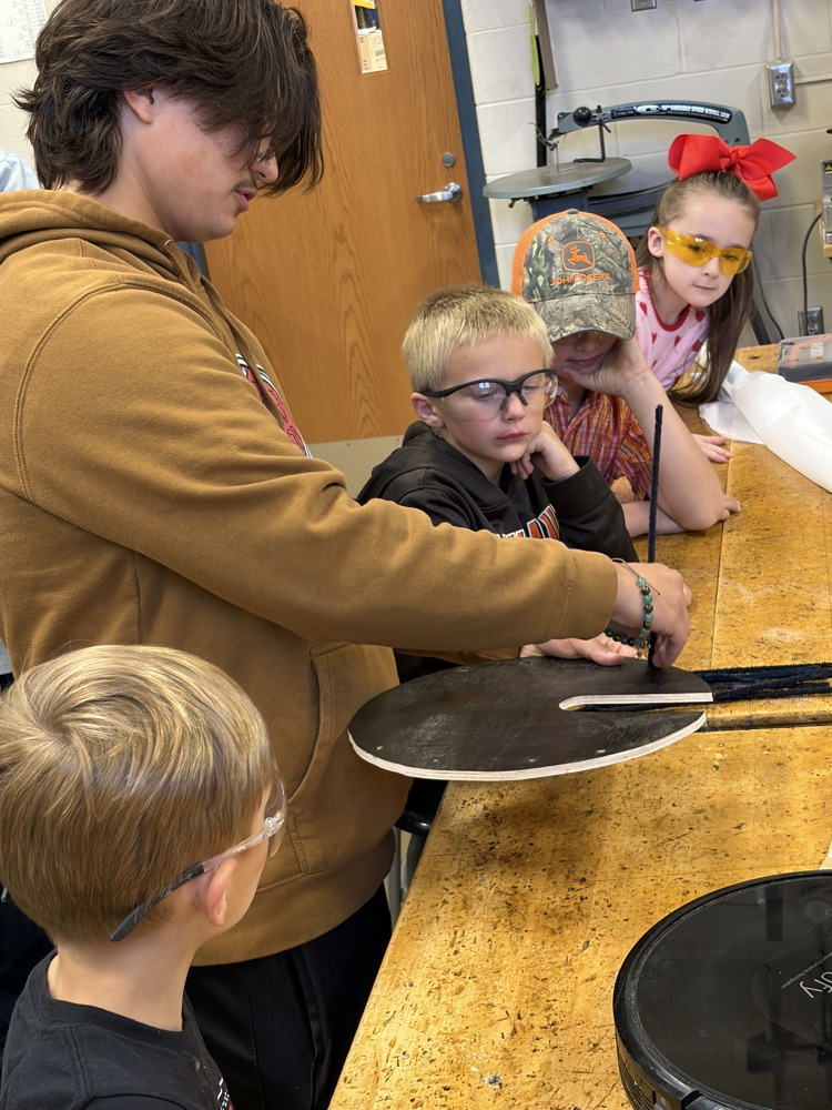 Elementary students helping HS robotics students build ROOMBA Halloween robots into ghosts/brooms/spiders