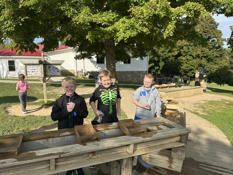students posing with their gems