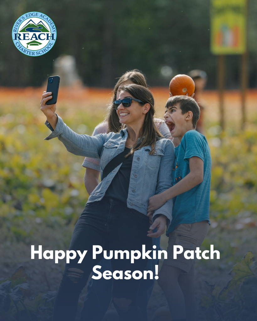 A woman takes a selfie with 2 kids holding pumpkins in front of a pumpkin patch.