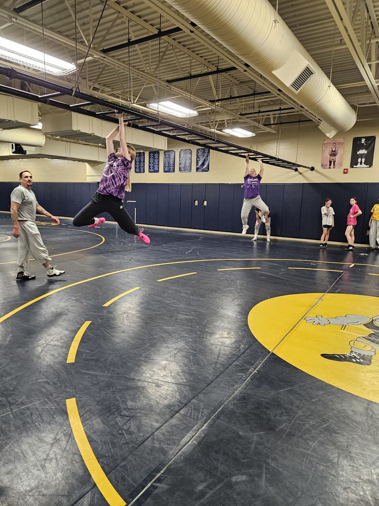 JH Wrestling girls practicing the monkey bars at the end of practice. 