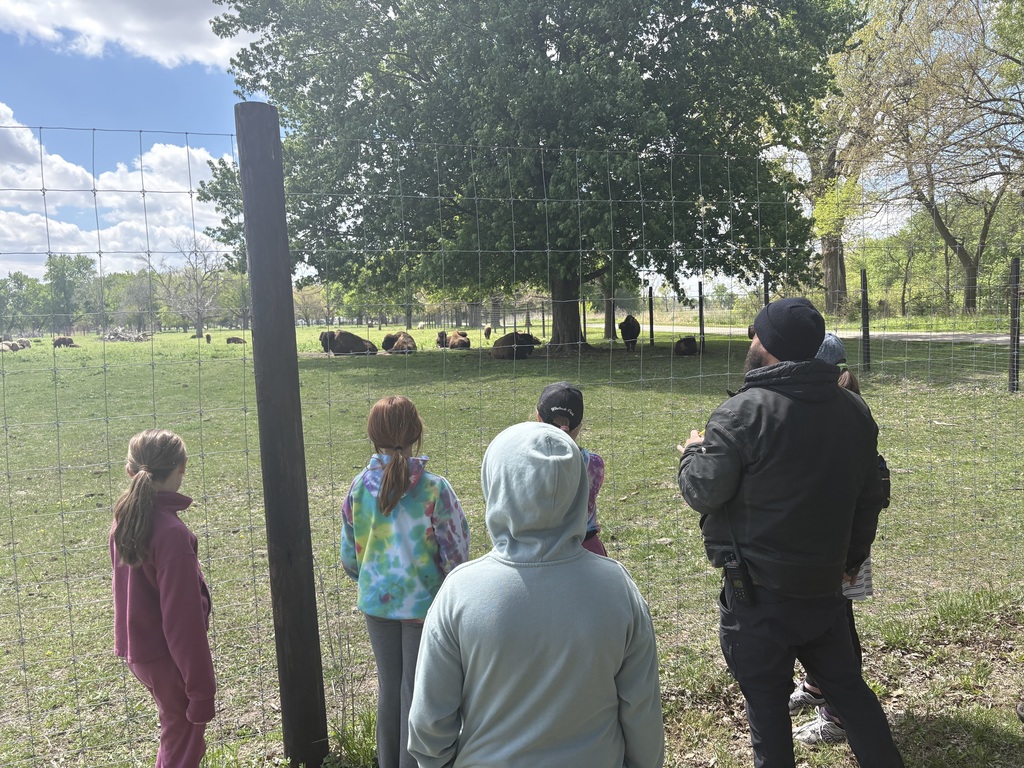 Park worker explaining the Botna Bend Bison Heard. 