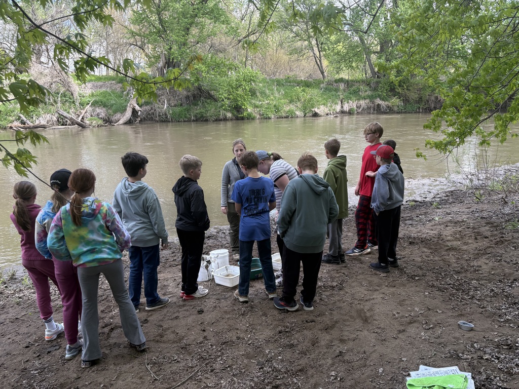 Ms. Laura explains the difference between a polluted and non-polluted river.