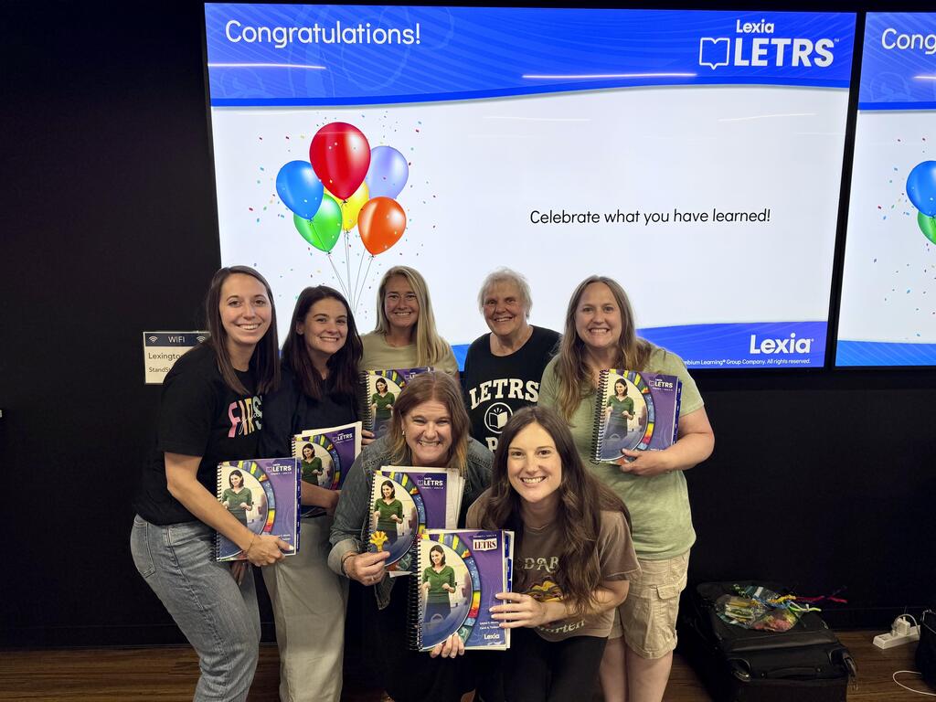 teachers celebrating training completion