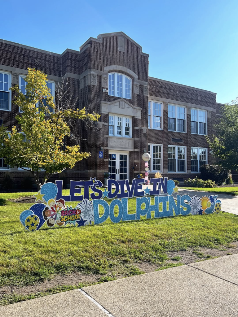 ames welcome sign let's dive in dolphins