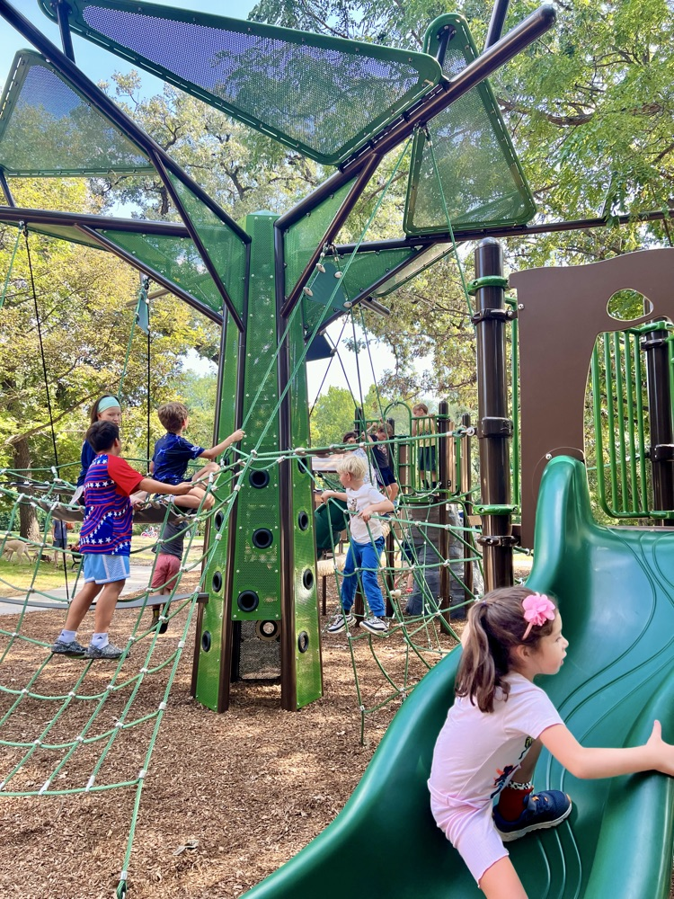Blythe playground with many children playing