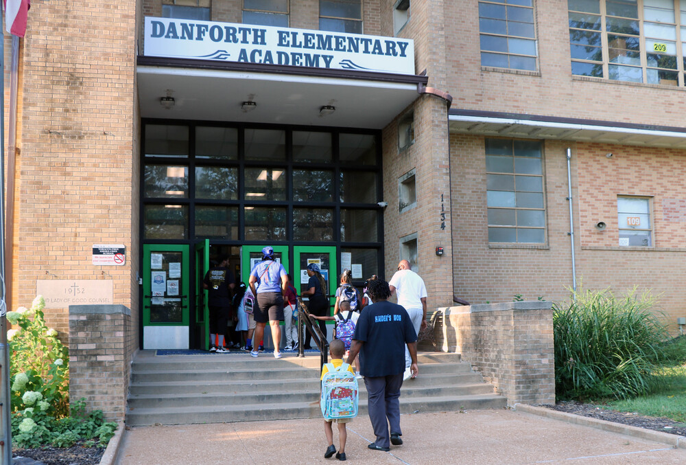 Students entering Danforth Elementary School on the first day of school