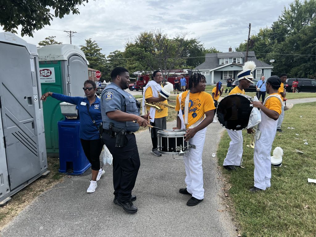 Cop playing the drums