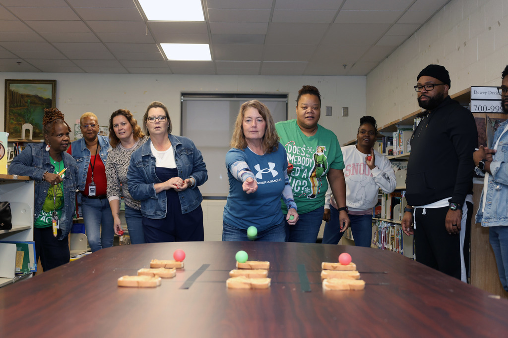 Moline staff with ping pong balls and peanut butter