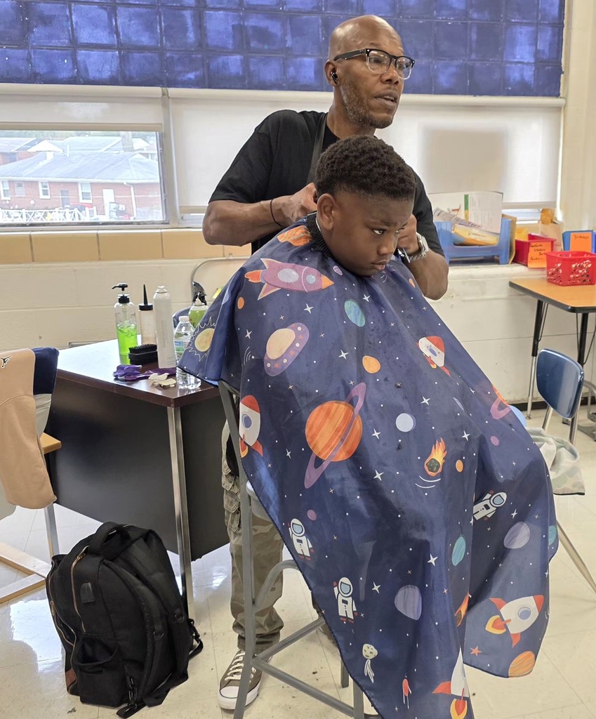 Danforth Elementary School brings barbers to provide free haircuts for kids.