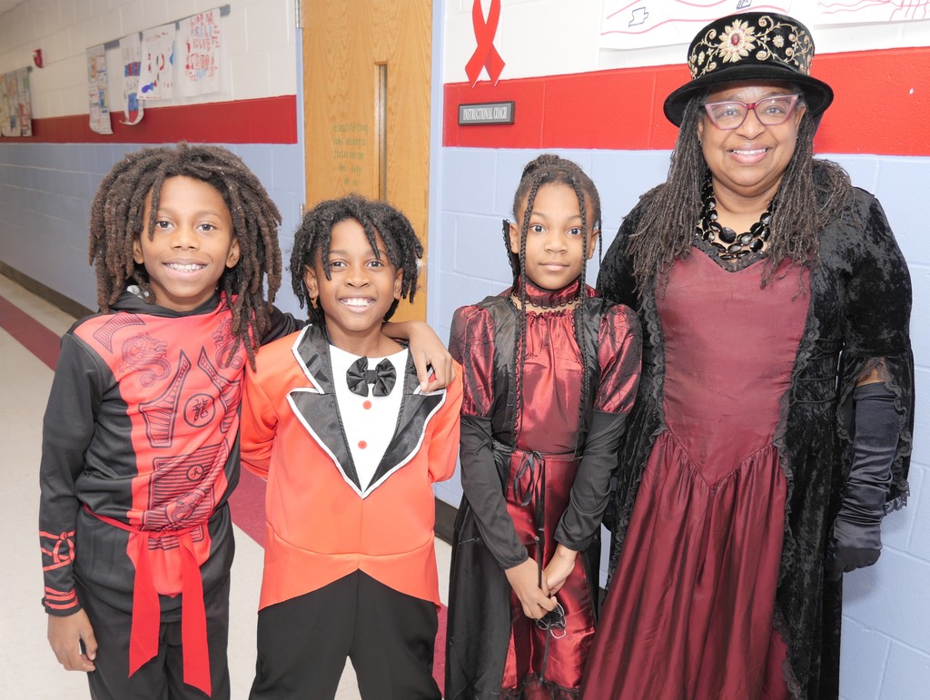 Highland ES scholars and teacher celebrate Halloween. 
