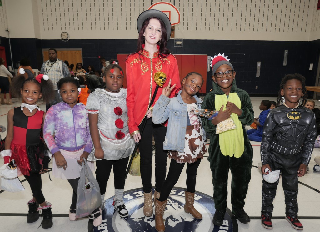 Highland ES scholars and teacher celebrate Halloween. 