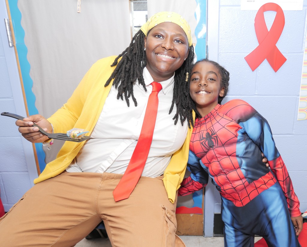 Highland ES scholar and teacher celebrate Halloween.