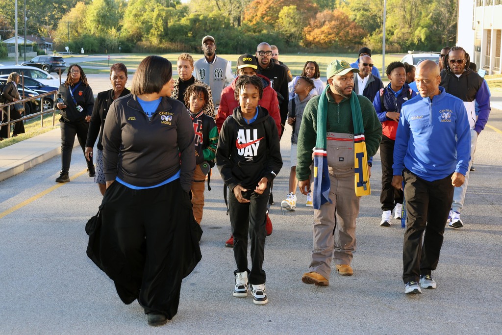 Central Middle School Father's Walk participants walk up the driveway