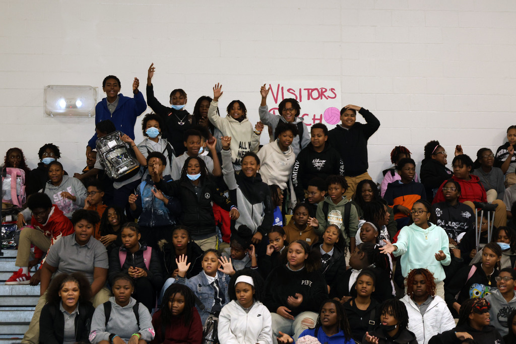 Westview Middle students standing in bleachers cheering