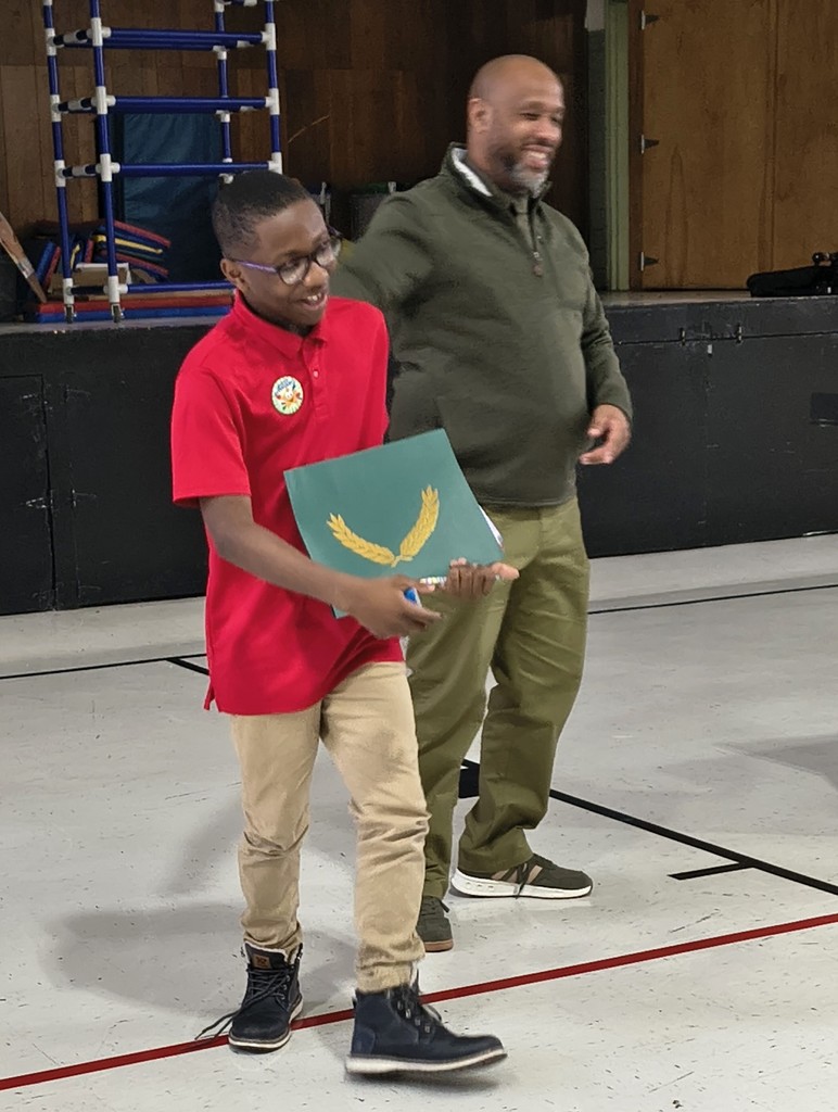 Danforth Elementary scholar Zaire B. receives the Principal's Award.