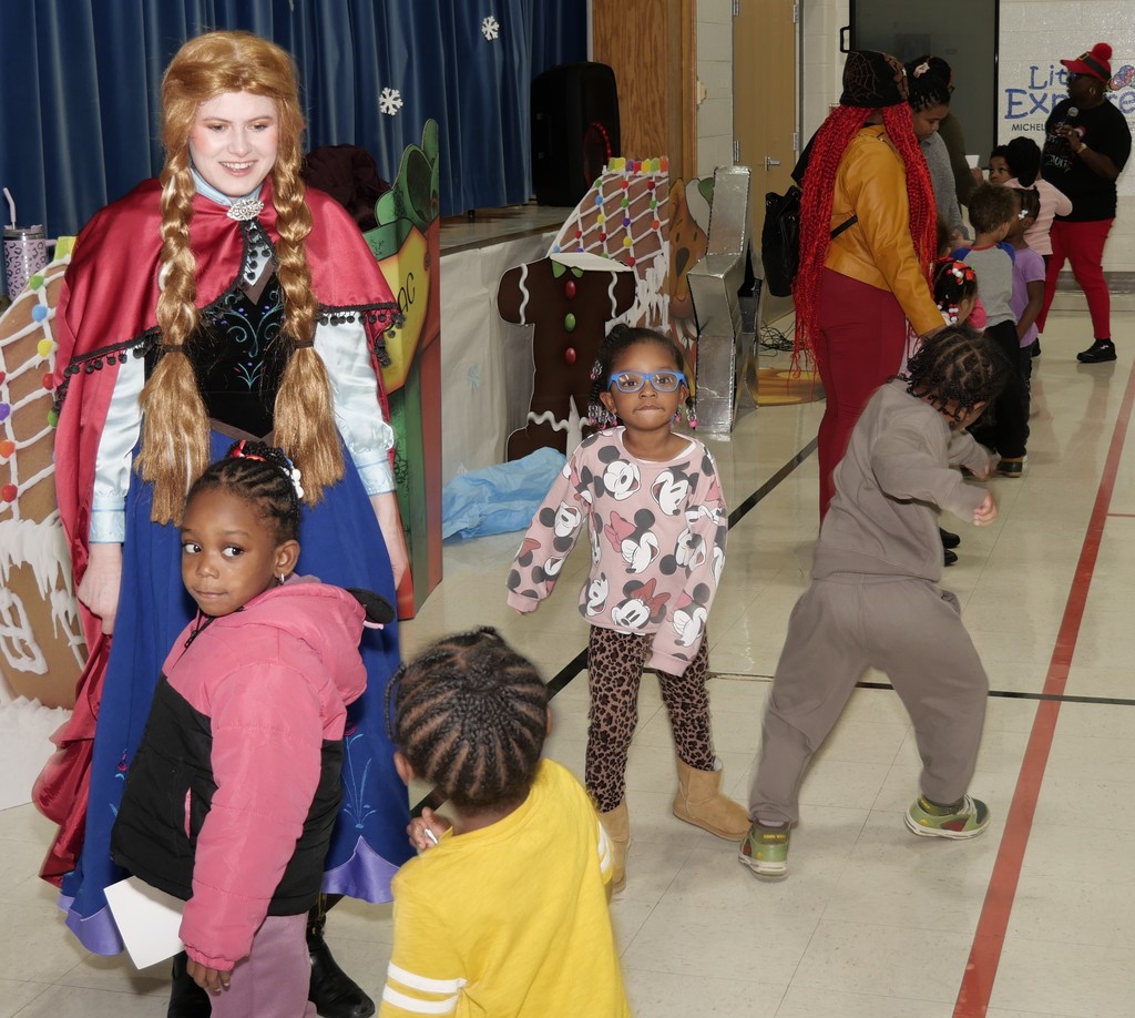 Elsa and scholars dancing.