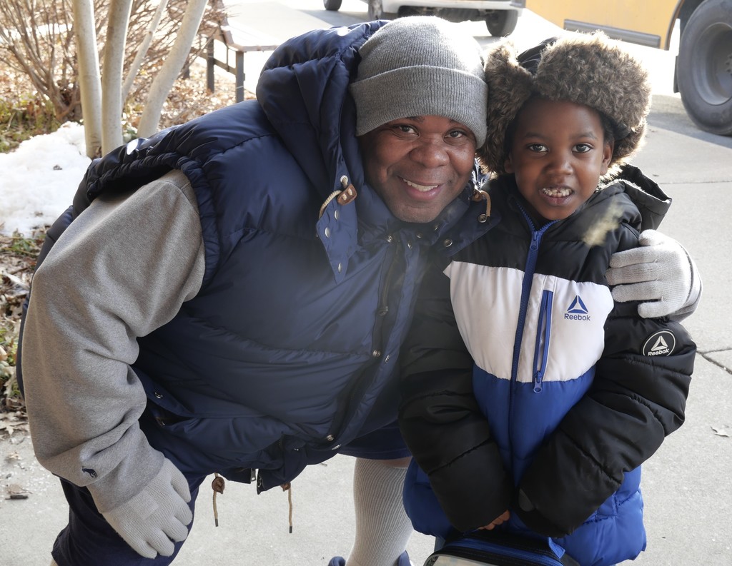 Dad and scholar dressed up for cold weather. 