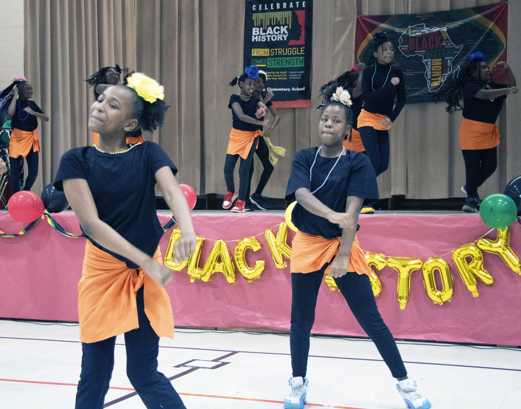 Girls dancing at Black History Month event