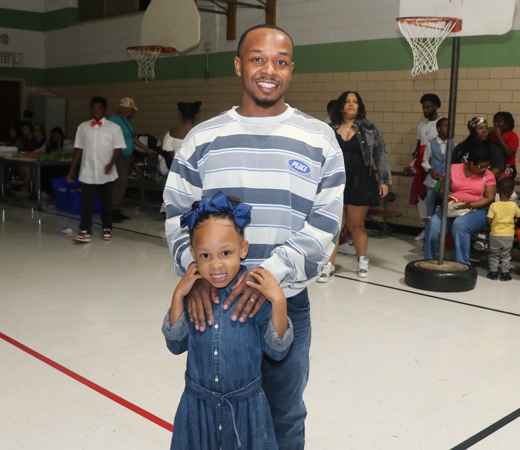 Danforth ES scholar and dad at Sneaker Ball. 