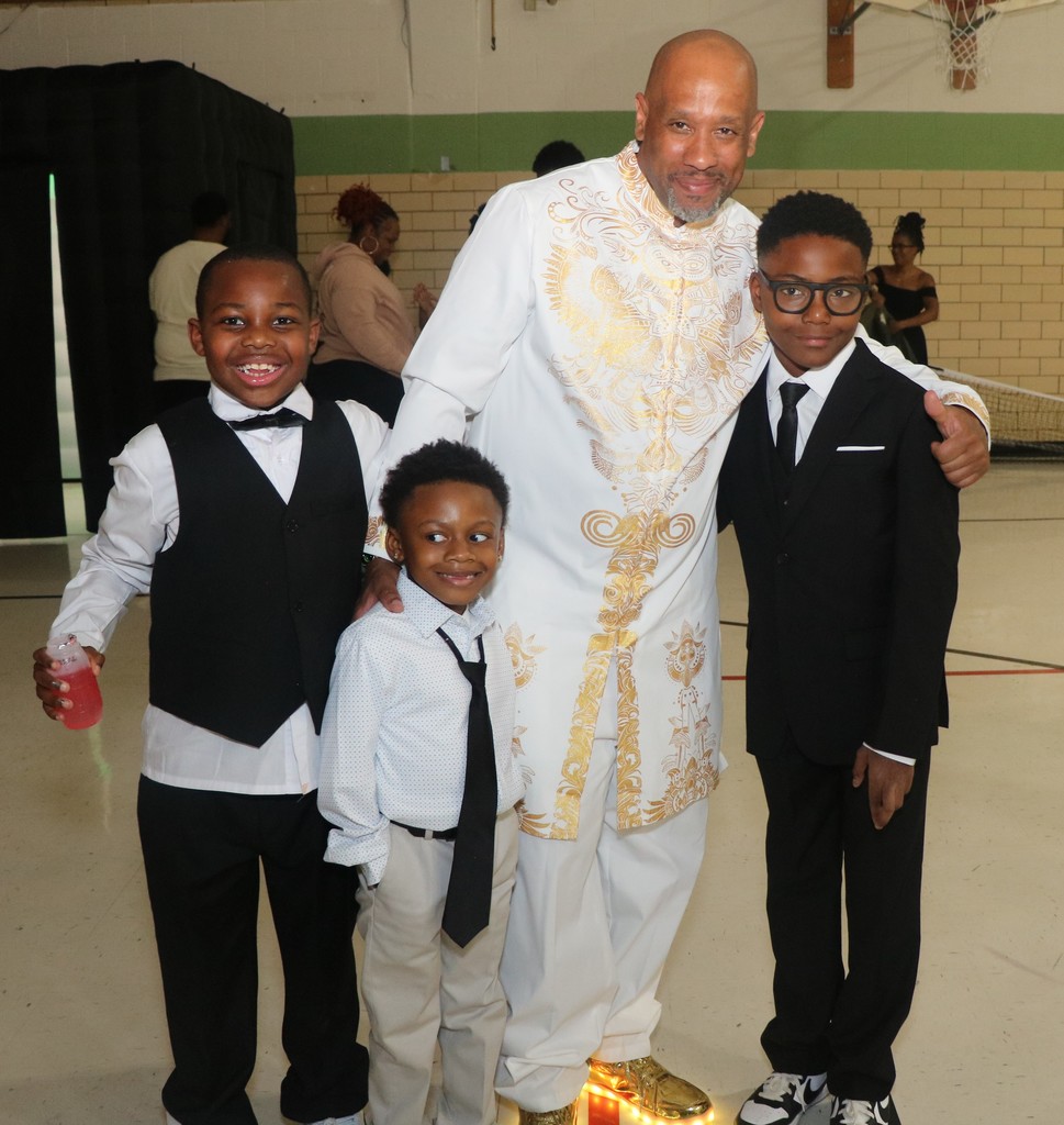 Principal Dominic Lenoir and scholars at Danforth ES Sneaker Ball