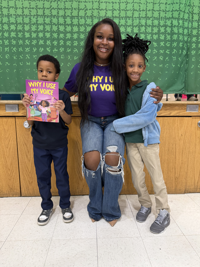 Precious Barry reads to RGSD scholars for Read Across America week. 