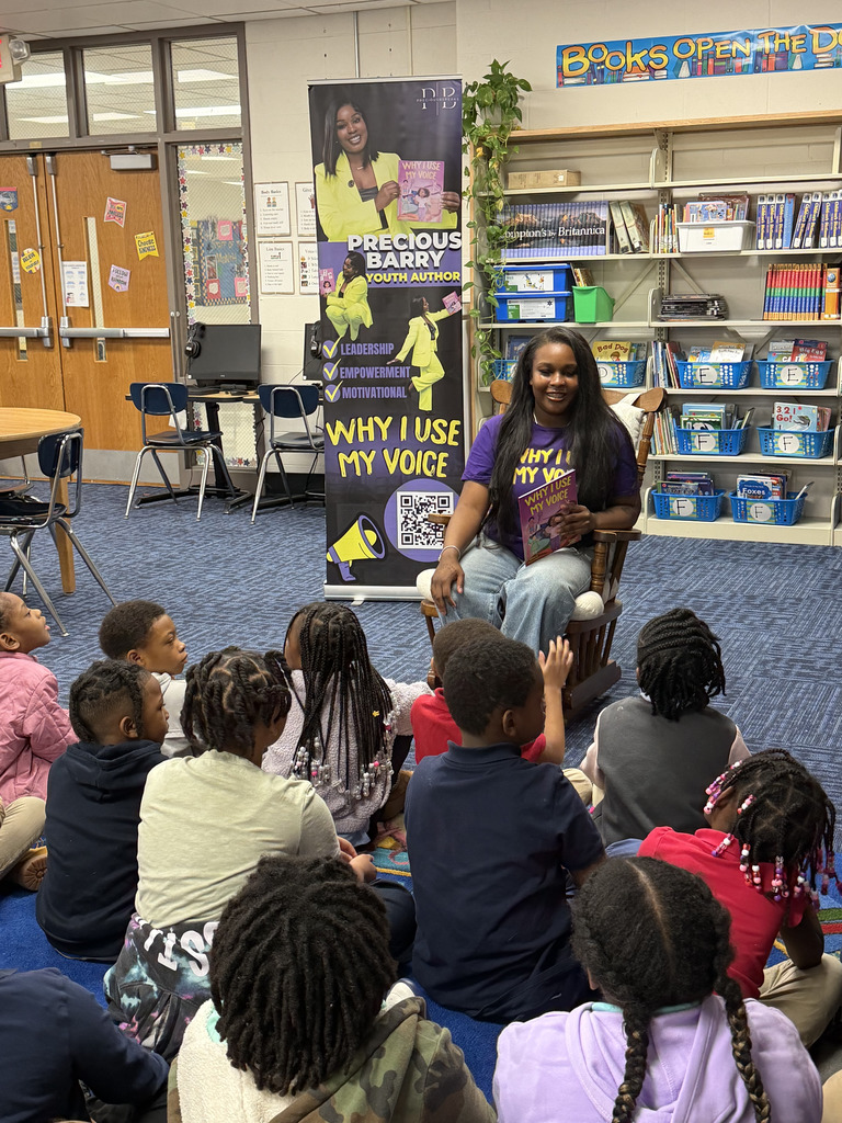 Precious Barry reads to RGSD scholars for Read Across America week. 