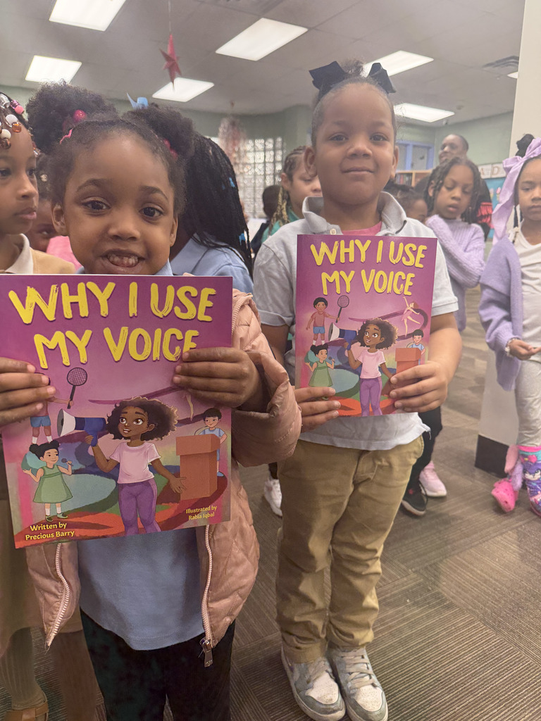 Precious Barry reads to RGSD scholars for Read Across America week. 